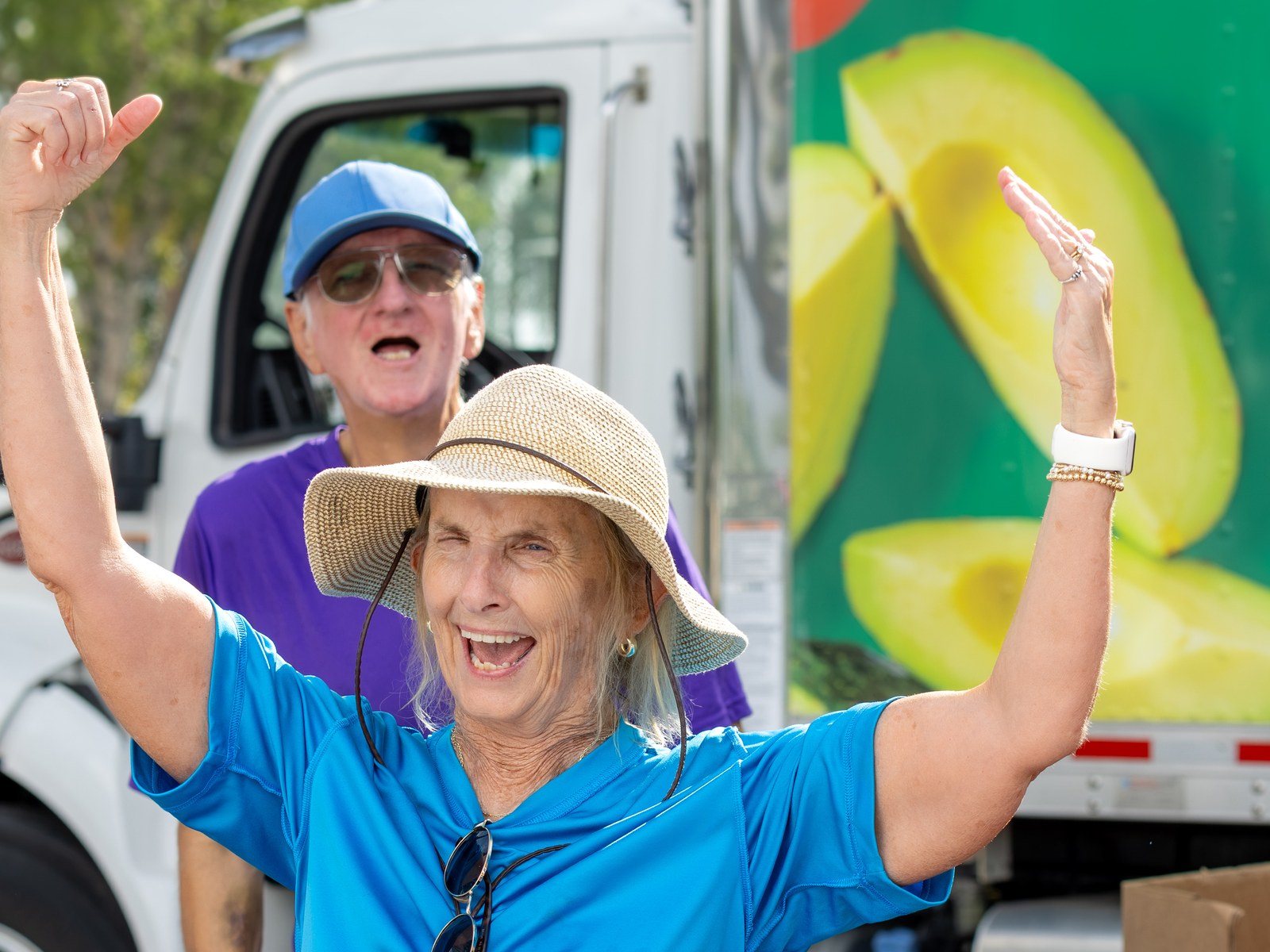 Volunteers celebrating together at a Harry Chapin Food Bank mobile distribution event