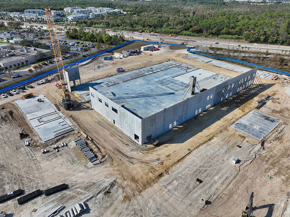 Hunger Action Center building shell under construction, with a crane on site